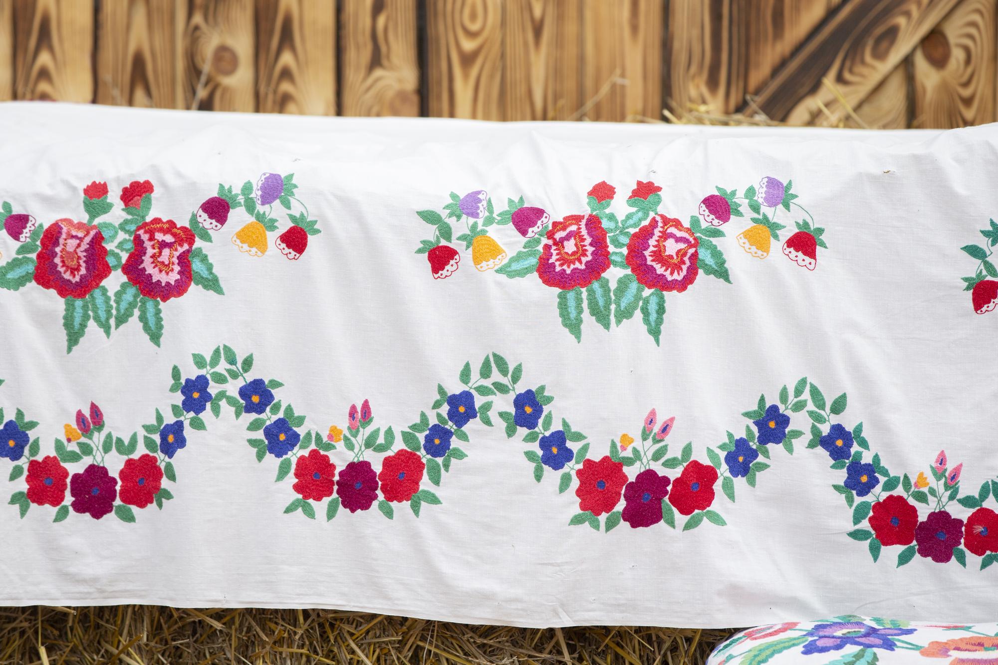 large table runner embroidered with folk motifs